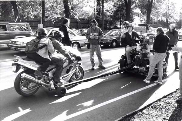 James Cameron (camera right with helmet) directing Moto Cam™ tow shot on 'True Lies' 